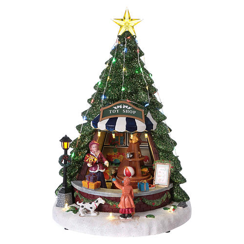 Christmas village with moving toy-shop scene and tree 30x25x25 cm 1