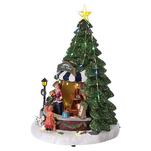 Christmas village with moving toy-shop scene and tree 30x25x25 cm 3