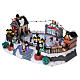 Christmas village with moving ice-skaters and Santa Claus 20x40x25 cm s3
