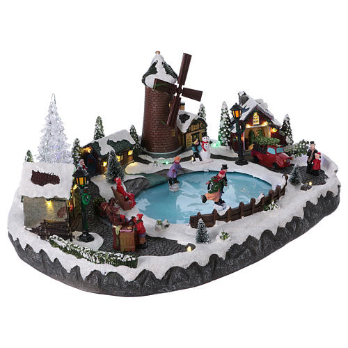 Christmas village with LED lights, moving ice-skaters, tree and mill 20x45x30 cm 4