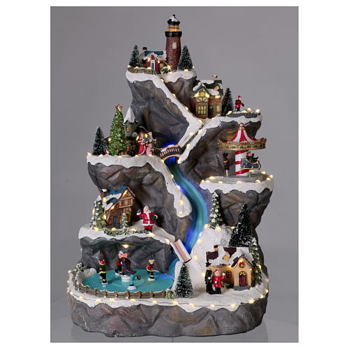 Christmas village with LED lights, moving ice-skaters, carousel and trees 50x30x30 cm 2