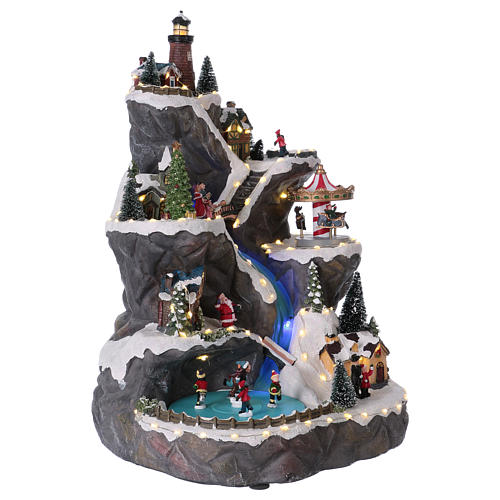 Christmas village with LED lights, moving ice-skaters, carousel and trees 50x30x30 cm 4