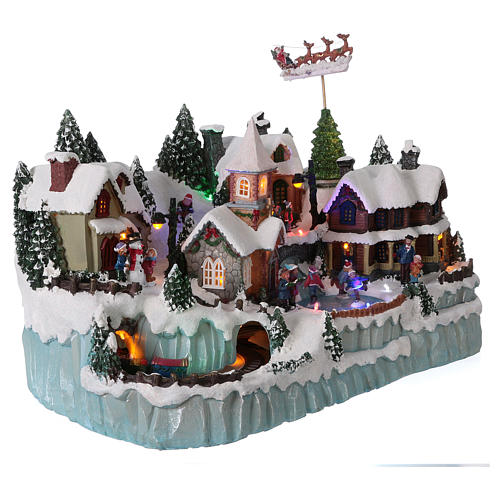 Christmas Village Scene with In-Motion Skaters and Train 40x55x30 cm electric powered 4