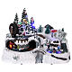 Christmas village with LED lights, moving ice-skaters and train 25x35x20 cm s1