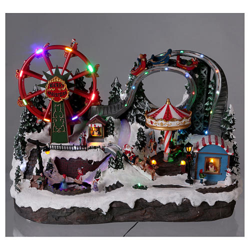 Christmas village with LED lights, moving ferris wheel and ice-skaters 40x55x35 cm 2