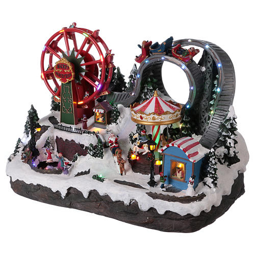 Christmas village with LED lights, moving ferris wheel and ice-skaters 40x55x35 cm 3