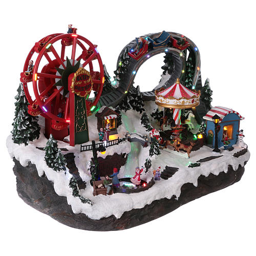 Christmas village with LED lights, moving ferris wheel and ice-skaters 40x55x35 cm 4