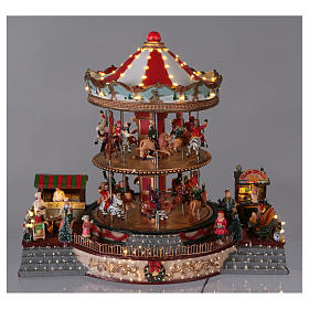 Illuminated Christmas Town with Moving Merry Go Round with music 35x40x35 cm electric powered