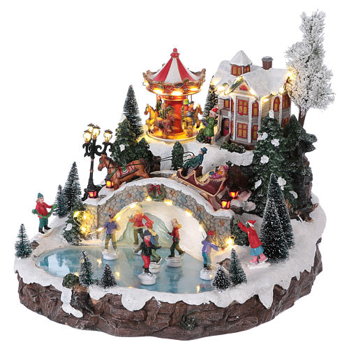 Weihnachtsdorf, mit Beleuchtung, Musik und beweglichen Eisläufern und kleinem Karussell, 30x35x35 cm, Netzanschluss 3