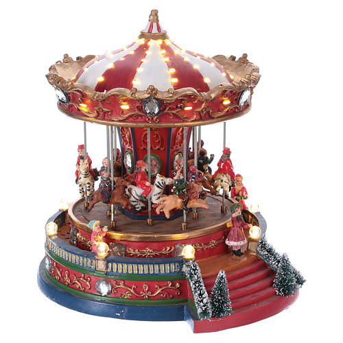 Village de Noël avec carrousel mouvement lumières musique 25x20x25 cm courant 4