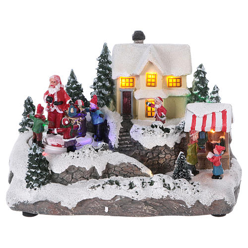 Winterszene Weihnachtsmann mit Kinder 15x20x15cm Licht und Bewegung mit Batterien 1