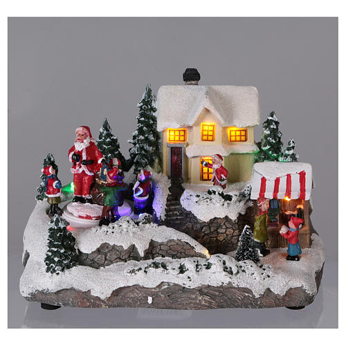 Christmas Village with Santa children and gifts 15x20x15 cm lights and motion battery powered 2