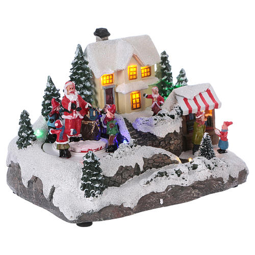 Christmas Village with Santa children and gifts 15x20x15 cm lights and motion battery powered 4