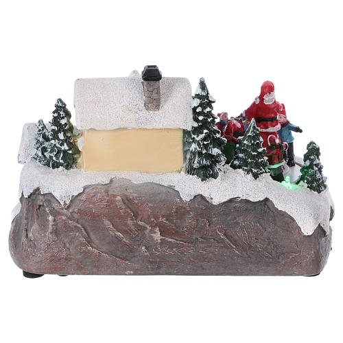 Christmas Village with Santa children and gifts 15x20x15 cm lights and motion battery powered 5