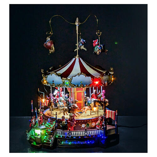 Scenka bożonarodzeniowa z karuzelą ruchomą podświetlana z melodią 25x30x30 cm zasilacz 2