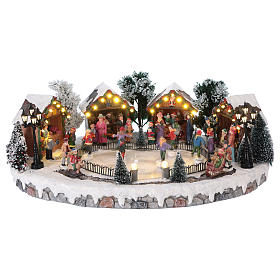 Villaggi Natalizi: Villaggio di Natale pista pattinaggio luci musica movimento 20x45x30 cm corrente