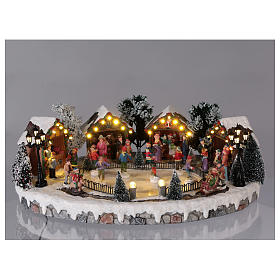 Villaggi Natalizi: Villaggio di Natale pista pattinaggio luci musica movimento 20x45x30 cm corrente