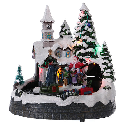 Christmas village with lights music, train and photoghrapher 20x20x15 cm 1