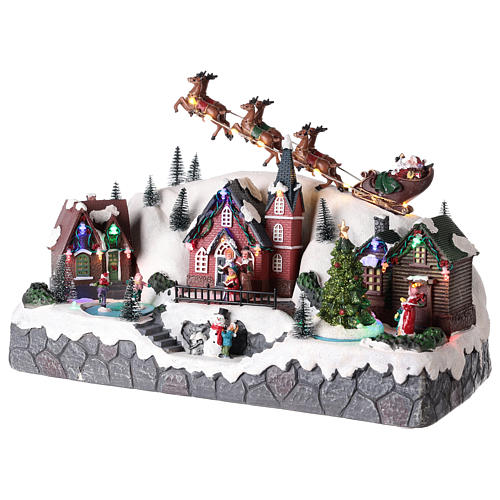 Villaggio di Natale con slitta di Babbo Natale in resina 25x40x20 cm 3