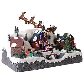 Christmas village with Santa sleigh in resin 25x40x20 cm s4