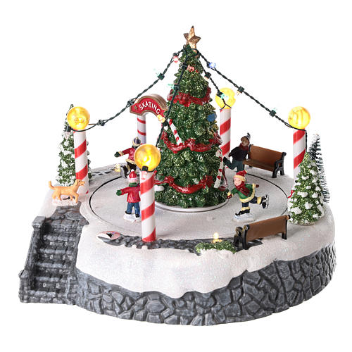 Round village with central tree and revolving skating rink 20x22 cm 3