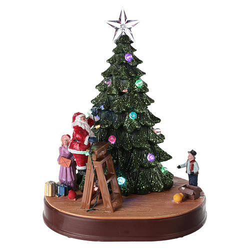 Winterszene, Weihnachtsmann schmückt einen Baum, mit Beleuchtung und Musik, 30x25x20 cm 1