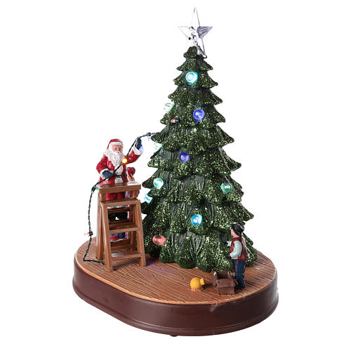 Winterszene, Weihnachtsmann schmückt einen Baum, mit Beleuchtung und Musik, 30x25x20 cm 3