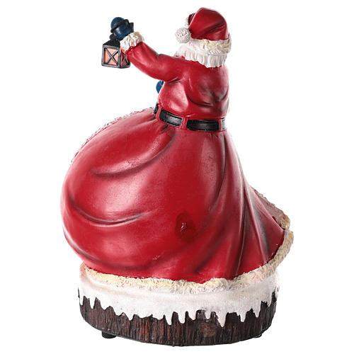 Statue of Santa Claus with village 30x20x15 5