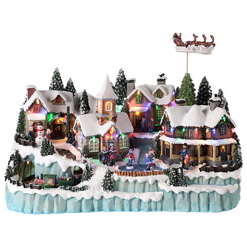 Winterdorf mit Weihnachtsmann im Schlitten, 40x55x30 cm 1