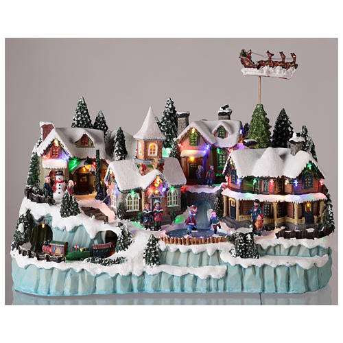 Village with Santa Claus on a moving sledge 40x55x30 cm. 2