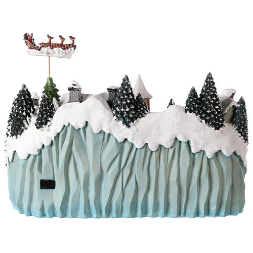 Village with Santa Claus on a moving sledge 40x55x30 cm. 5