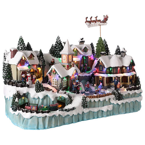 Christmas village with moving Santa sleigh 40x55x30 cm 4