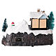 Village with Santa Claus on a moving sled 20x25x15 cm s5