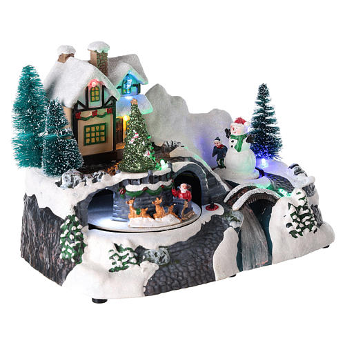 Winter Village with moving Santa Claus on sled 20x25x15 cm 4