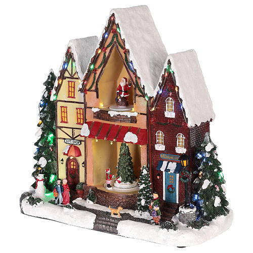 Casa di Natale con movimenti luci e musica 35x35x15 cm 3