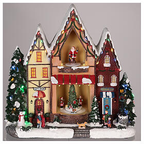 Domek Bożonarodzeniowy z ruchem, światełkami i melodyjką 35x35x15 cm