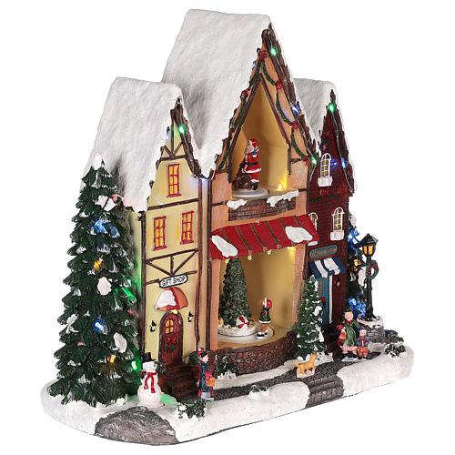 Christmas village house with movement lights and music 35x35x15 cm 4