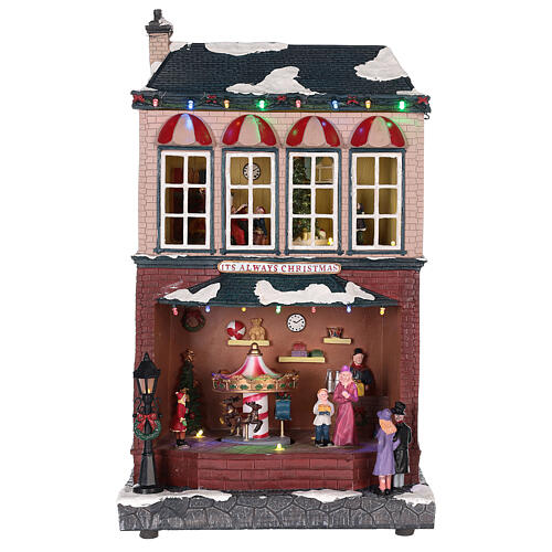 Casa de Navidad con tiovivo y Papá Noel 45x25x20 cm 1