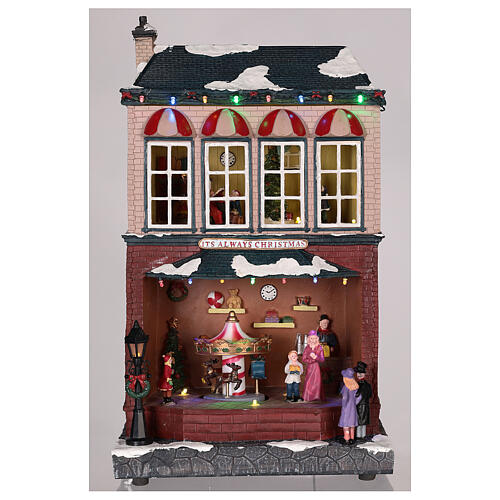 Casa di Natale con giostrina e Babbo Natale 45x25x20 cm 2