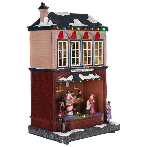 Casa di Natale con giostrina e Babbo Natale 45x25x20 cm 4