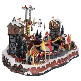 Christmas amusement park with tightrope walkers and carousel 45x65x45 cm s4