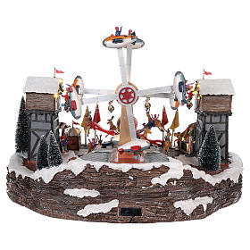 Christmas amusement park with tightrope walkers and carousel 45x65x45 cm s5