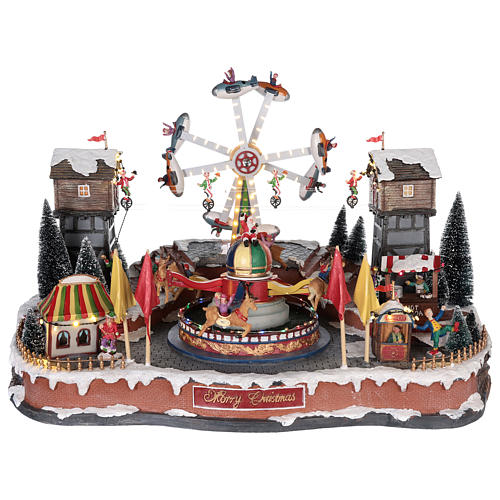 Christmas amusement park with tightrope walkers and carousel 45x65x45 cm 1
