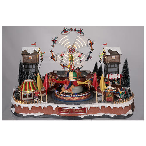 Christmas amusement park with tightrope walkers and carousel 45x65x45 cm 2