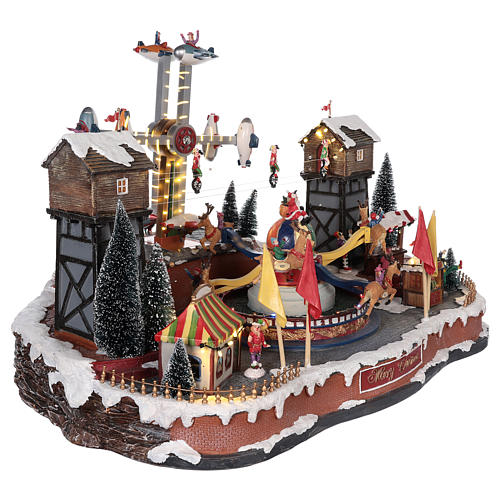 Christmas amusement park with tightrope walkers and carousel 45x65x45 cm 4