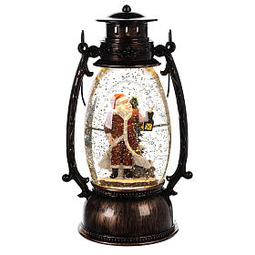 Globo de vidro com neve e Pai Natal numa lanterna 25x10 cm