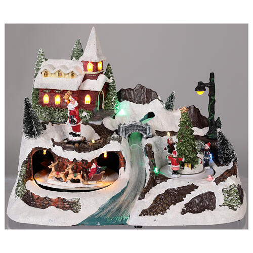 Weihnachtsdorf mit Weihnachtsmann und Kindern mit bewegten Elementen, 20x30x20 cm 2
