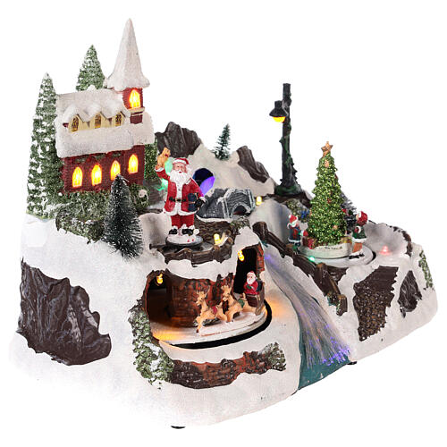 Christmas village with Santa and children in motion 20x30x20 cm 4