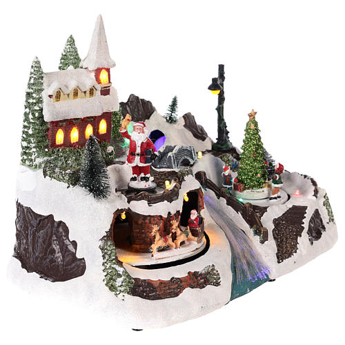 Christmas village with Santa Claus and kids in motion 20x30x20 cm 4