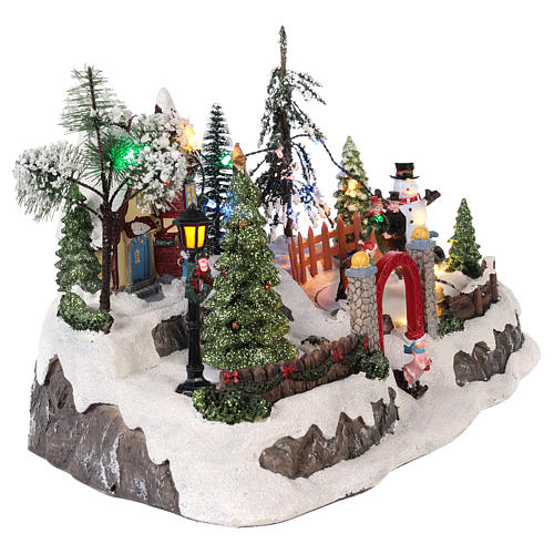 Village de Noël avec mouvement et lumières 20x30x20 cm 4